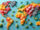 A selection of colorful international healthy candies, including green matcha mochi and white coconut cocadas, displayed over a world map, highlighting the global nature of healthy candy swaps.